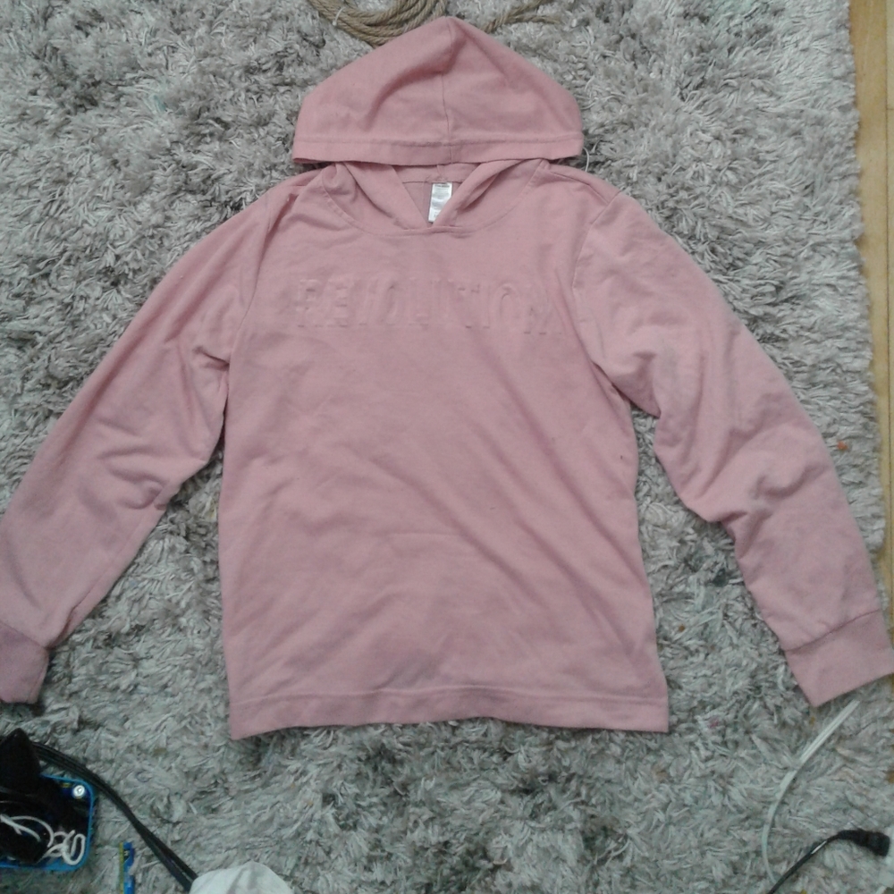 Grey, baby pink, black, and white graphic t-shirts and long sleeve tops